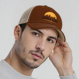 A brown mesh back trucker hat with a logo, featuring a tan front and a tan mesh back.