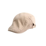 A beige beret hat with a curved brim and a strap at the back, featuring a logo on the side.
