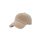 A beige lamb fur baseball cap featuring a soft, textured surface and a curved brim. It includes a logo on the front.