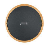 A round bamboo cheese board with a black slate top and a logo printed on it.