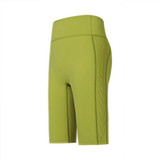 High-waisted elastic yoga leggings in a vibrant green colour with a smooth finish and side panel detailing.