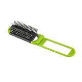 A folding hair brush with a mirror, featuring a black and green design. The brush has flexible bristles and a compact handle.