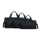 A set of three durable duffle bags in black, featuring sturdy handles and adjustable straps. Each bag has a logo.