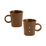 A brown ceramic coffee mug with a handle and two magnetic dots on the side, featuring a simple design.