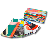A collection of vibrant, patterned sublimated sports towels featuring various designs and colours stacked together.