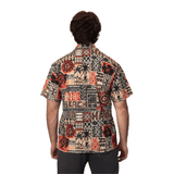 A patterned button-up shirt in earthy tones featuring various tribal designs and a logo on the back.
