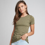 A fitted women's olive green crew neck t-shirt with short sleeves displayed on a model. The shirt features a logo.