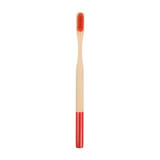 A colorful bamboo toothbrush with a red handle and a natural bamboo bristle head. It has a logo on the handle.