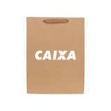 A large brown paper bag with a fabric flat handle and a logo on the front.