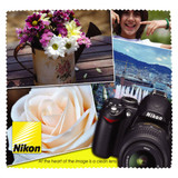 A large microfibre cleaning cloth featuring a design with flowers, a cityscape, and a camera. It has a logo.