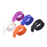 A set of four silicone slap band flash drives in white, purple, blue, orange, and black, featuring a logo.