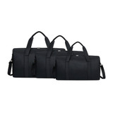 A set of three black durable duffle bags in varying sizes, featuring handles and removable shoulder straps.