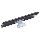 A phone grip in white attached to the back of a black smartphone. The grip features a rounded design for stability.