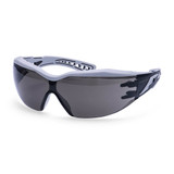 A pair of Dynamic Plus Safety Glasses with a grey frame and dark tinted lenses, featuring a logo on the side.