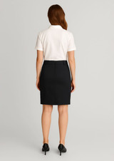 A black women's mid waist stretch chino skirt displayed on a model from the back, paired with a white polo shirt.