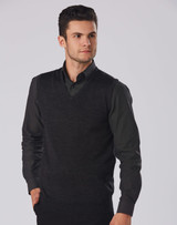 A men's black 100% Merino wool V-neck vest worn over a dark shirt, featuring a fitted design.