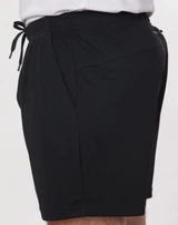 Black bamboo charcoal sports shorts featuring an elastic waistband and side pockets. Includes a logo on the fabric.