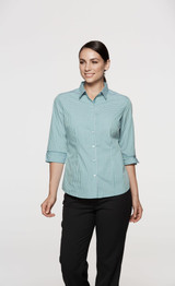 A button-up shirt in a teal and white check pattern with 3/4 sleeves, featuring a collar and rolled cuffs.