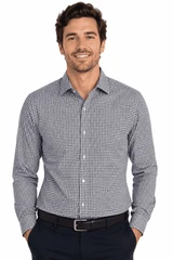 A long-sleeve button-up shirt in a navy and white check pattern, with a slim fit design and a branded logo.