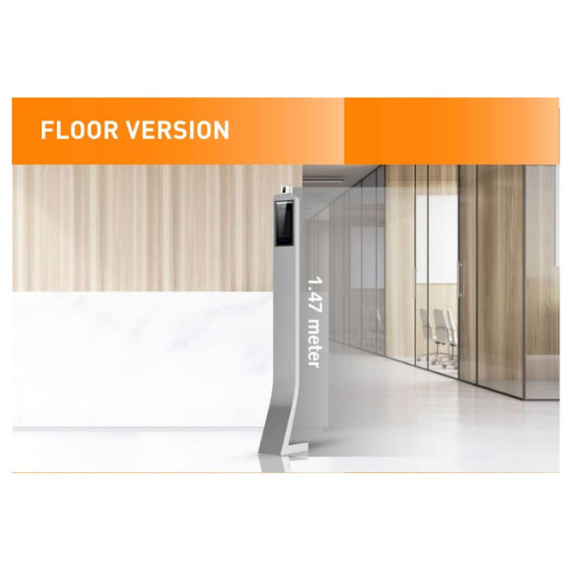 A temperature screening kiosk with a sleek silver floor stand, positioned in a modern office environment.