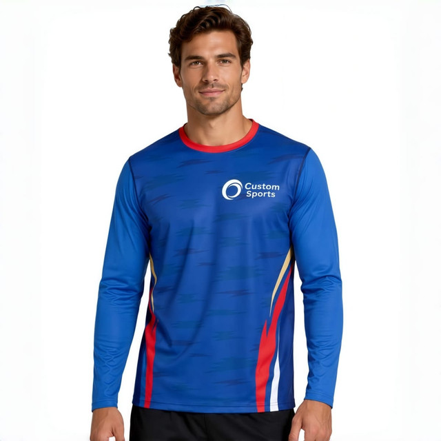 A long-sleeved T-shirt in blue with red accents, featuring a logo on the chest. Made from polyester and spandex.