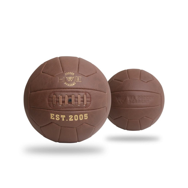 A vintage brown soccer ball featuring stitching details and a logo, set against a plain background.