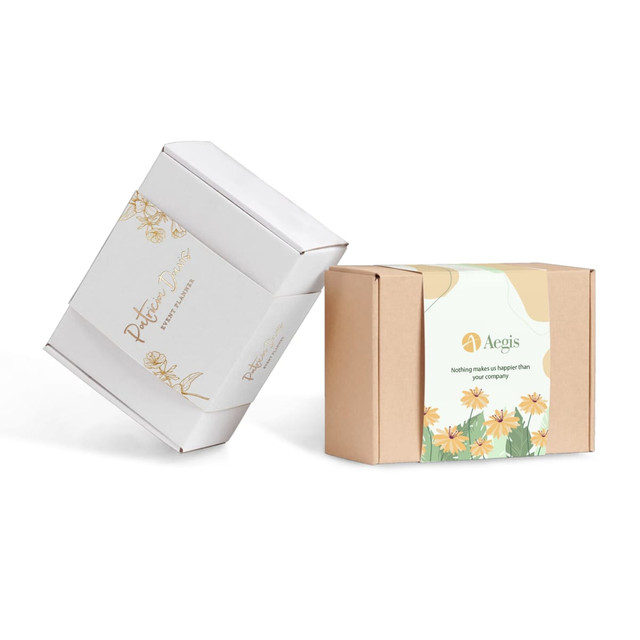 Two custom packaging sleeves in white and kraft brown, featuring floral designs and branding elements.