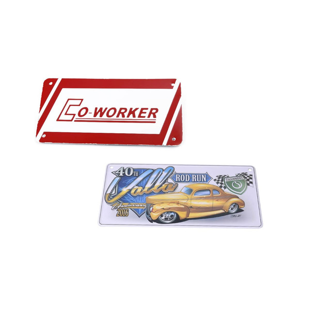 A red and white licence plate with "CO-WORKER" and a graphic of a yellow vintage car for a rod run event.