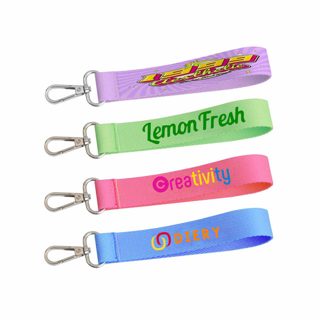 A set of four colourful sublimation keyrings in green, pink, purple, and blue, each with a different printed design. A set of four colourful sublimation keyrings in green, pink, purple, and blue, each with a different printed design.