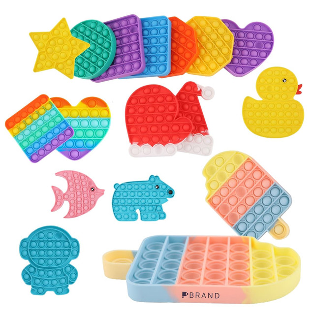 A collection of colourful Pop It fidget toys in various shapes including stars, hearts, a duck, and a bear.