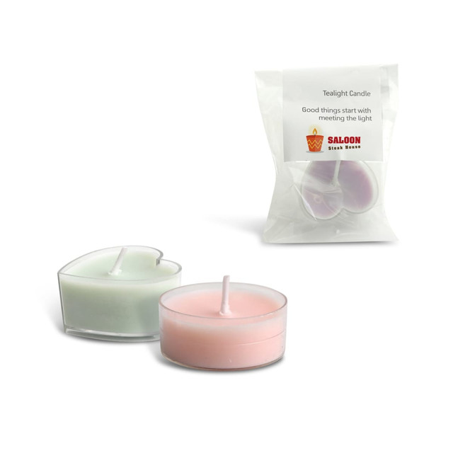 Tealight candles in heart and circular shapes, featuring green and pink hues, packaged in a clear plastic bag.