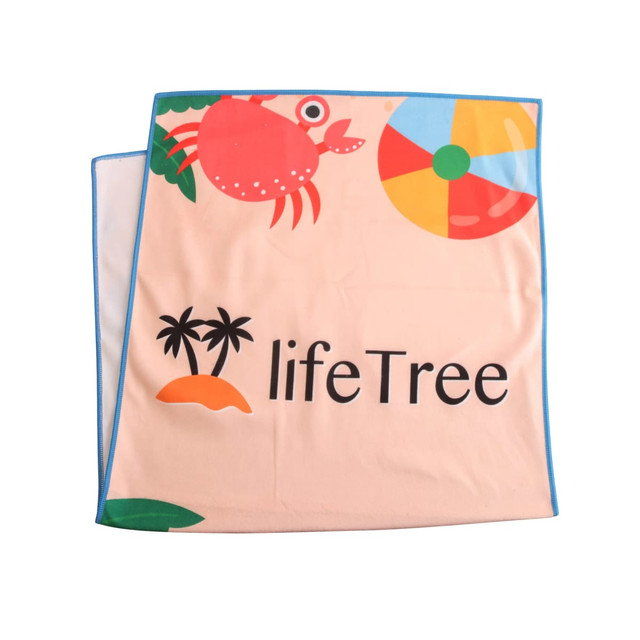 A microfibre beach towel in peach colour featuring a crab, beach ball, and palm trees, with branding present.
