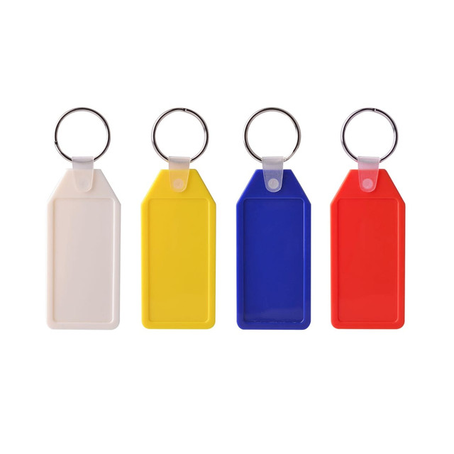 A set of four long hexagon hard plastic keyrings in white, yellow, blue, and red, each with a metal keyring attachment.