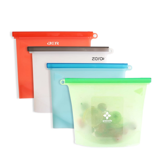 Four silicone reusable storage pouches in orange, clear, blue, and green, featuring various logos and contents inside.