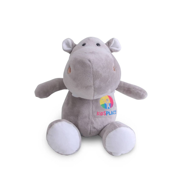 A grey hippopotamus plush toy with white accents and a logo on its body.