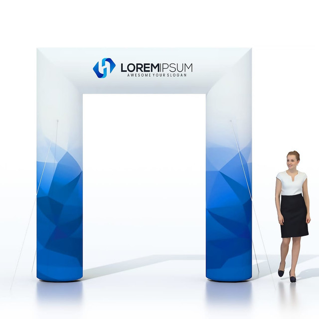 An inflatable event arch in blue with a geometric design and a logo is displayed beside a standing woman.