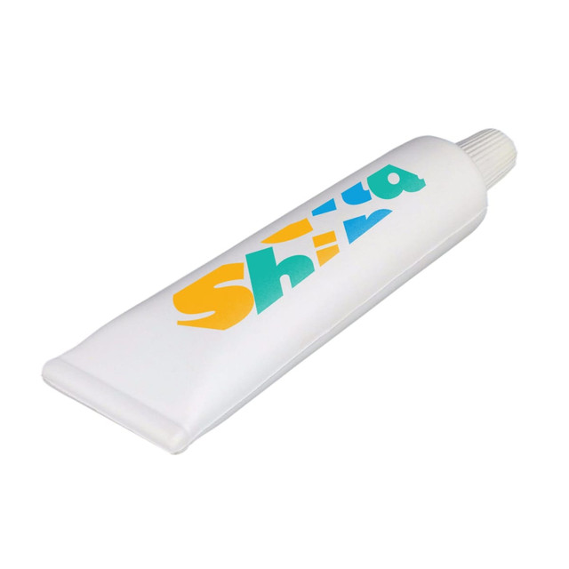 A large white stress reliever shaped like a tube of toothpaste, featuring colourful branding.