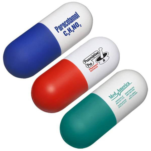 A capsule-shaped stress reliever in blue, red, and green, with a logo on one side.