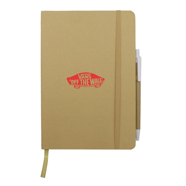 A tan A5 notebook with a logo and an attached pen. It features an elastic band and a ribbon bookmark.
