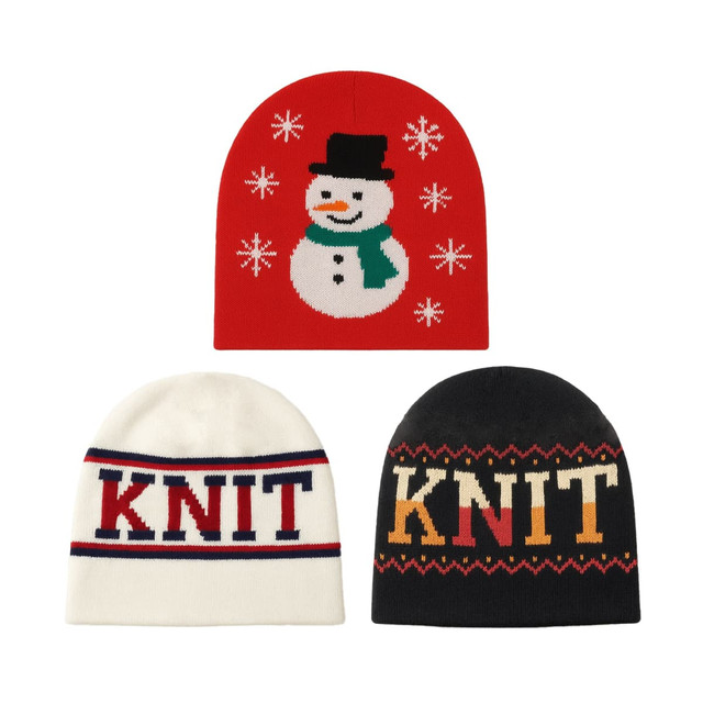 Three beanies in various designs: a red one with a snowman, a cream one with "Knit" text, and a black one with patterned text.
