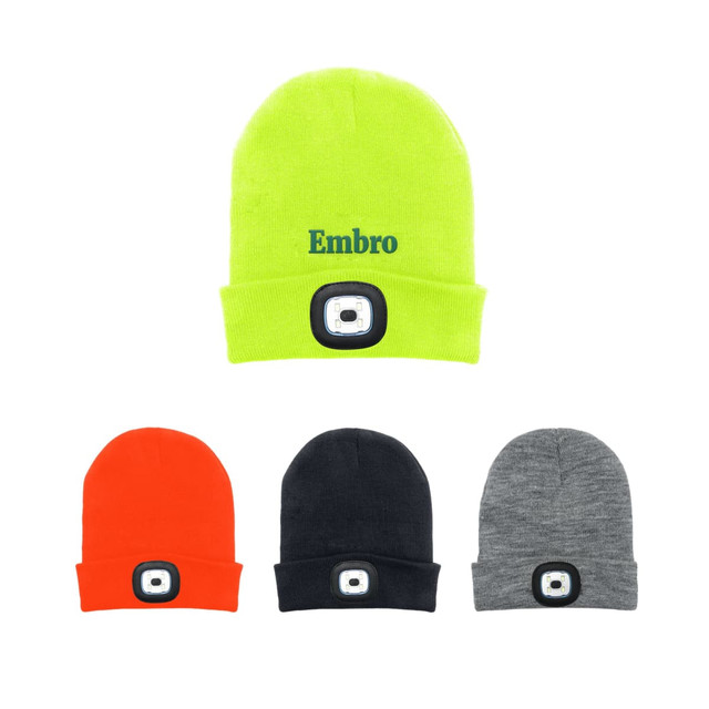 A collection of beanies in bright yellow, orange, black, and grey, each featuring a headlamp on the front.