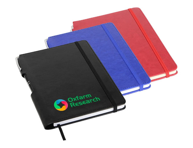 A set of three A5 notebooks in black, blue, and red, featuring an embossed logo on the black notebook. A set of three A5 notebooks in black, blue, and red, featuring an embossed logo on the black notebook.