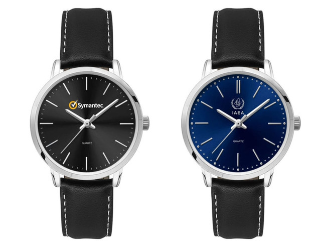 A pair of ladies' dress watches featuring a black and a navy blue dial, both with leather straps and silver-tone cases.