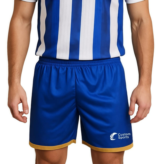Breathable soccer shorts in blue with a gold trim and a logo on the lower hem.