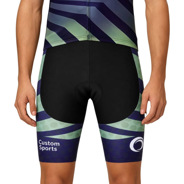 Men's cycling shorts in black, green, and navy with a distinct pattern and a logo.