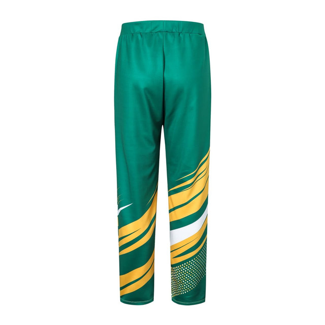 Sublimated sports pants in green with yellow and white patterns. Features an elastic waistband and a logo.