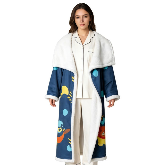 A blanket robe featuring a navy blue design with colourful cartoon sea creatures and a fluffy white collar and cuffs.