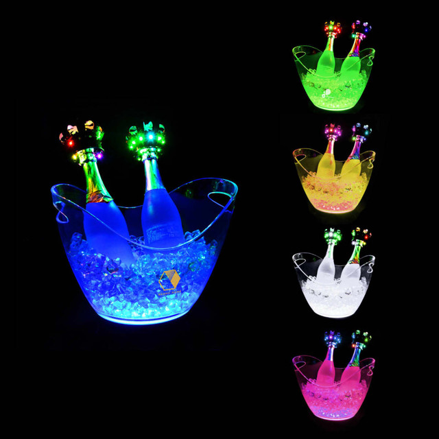 A LED ice bucket in assorted colours, containing two bottles and decorative lights, surrounded by ice.