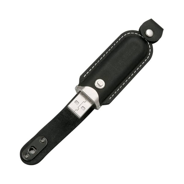 A black leather flash drive with a metal connector, featuring a snap closure and a logo on the leather.