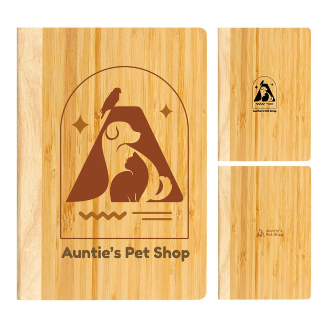 A bamboo notebook with an illustration of animals and a logo, featuring a natural wood finish.